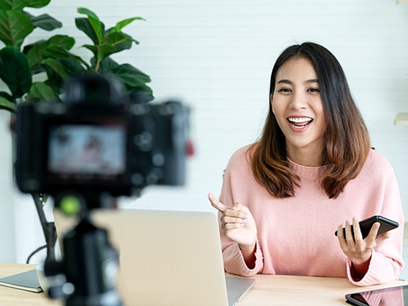 young woman making a piece to camera for influencer marketing or social media